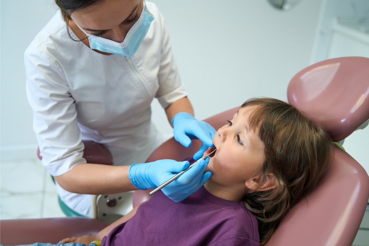 Tooth growing in upper gums of my child - What to Do